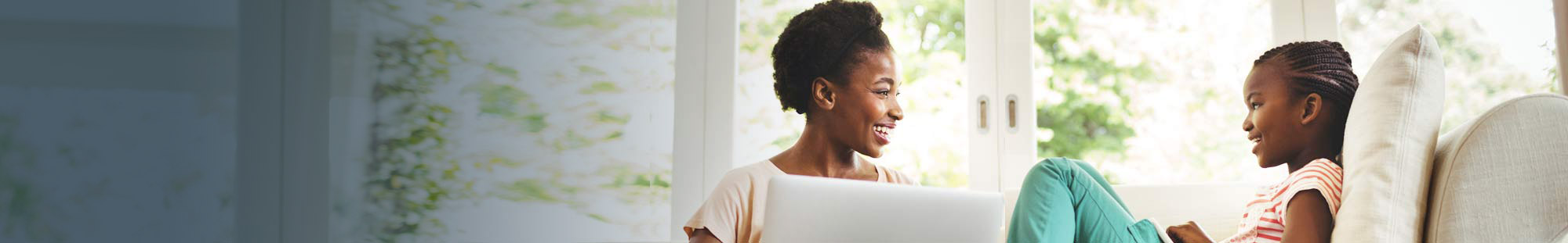 A mother and child with a laptop